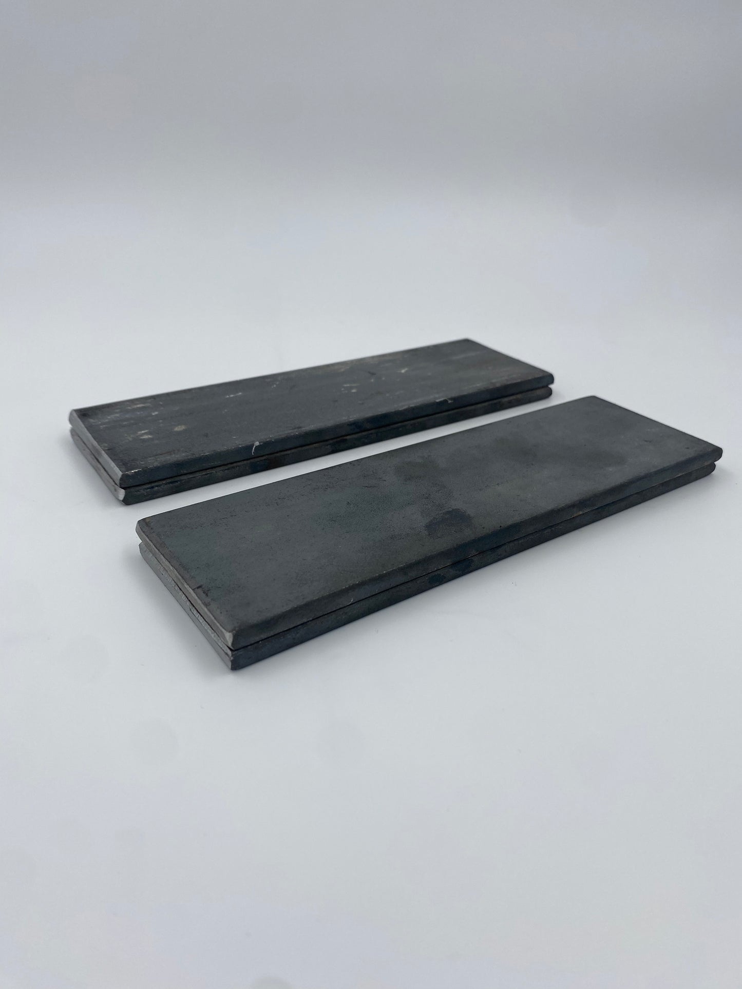 Two stacks of hot rolled carbon, steel rectangle plates