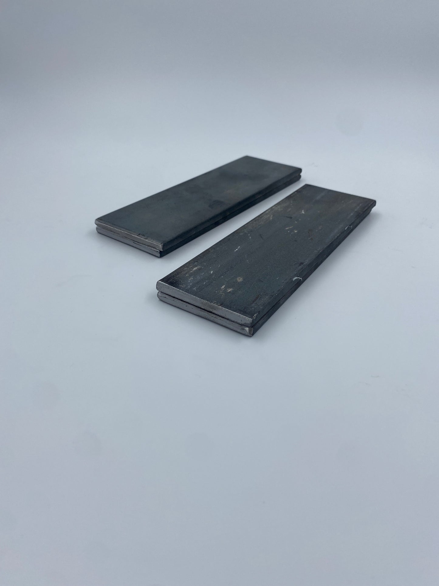 Two stacks of rectangle, steel plates