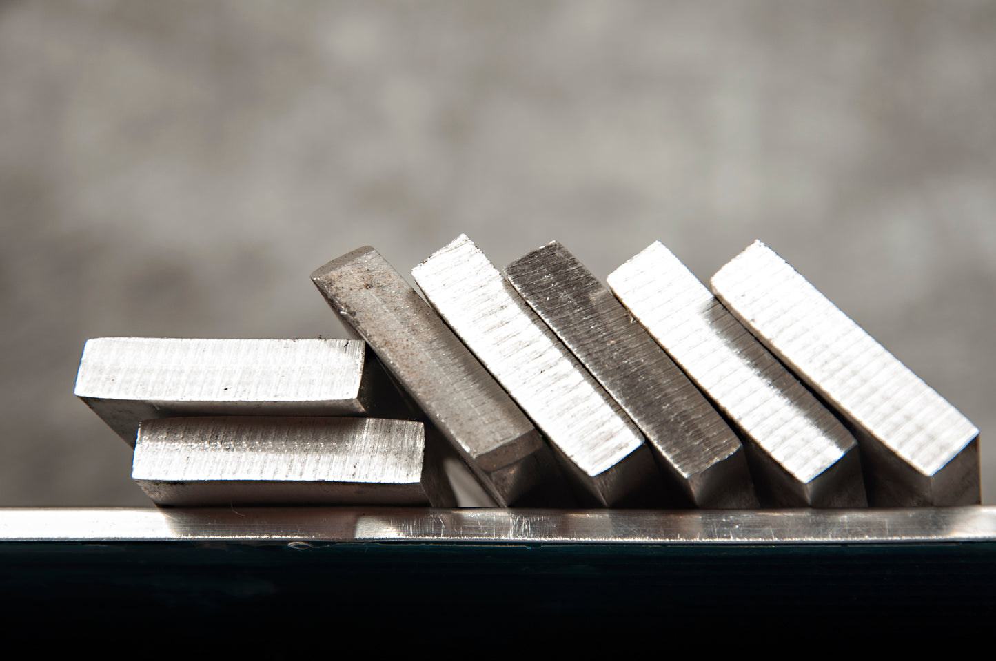 Pile of flat bar strip plate with the ends visible displaying the thickness