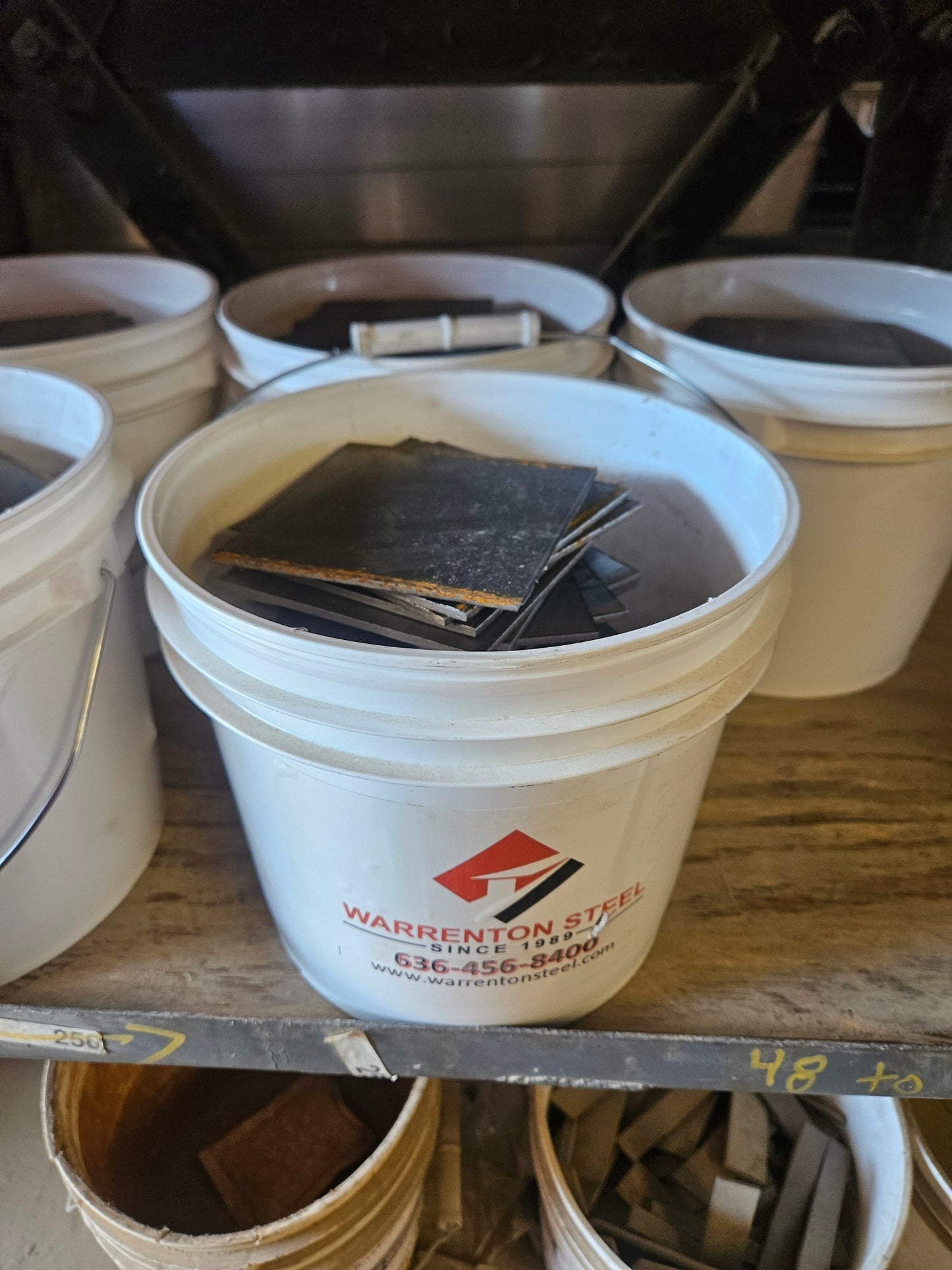 Bucket full of steel shim plates