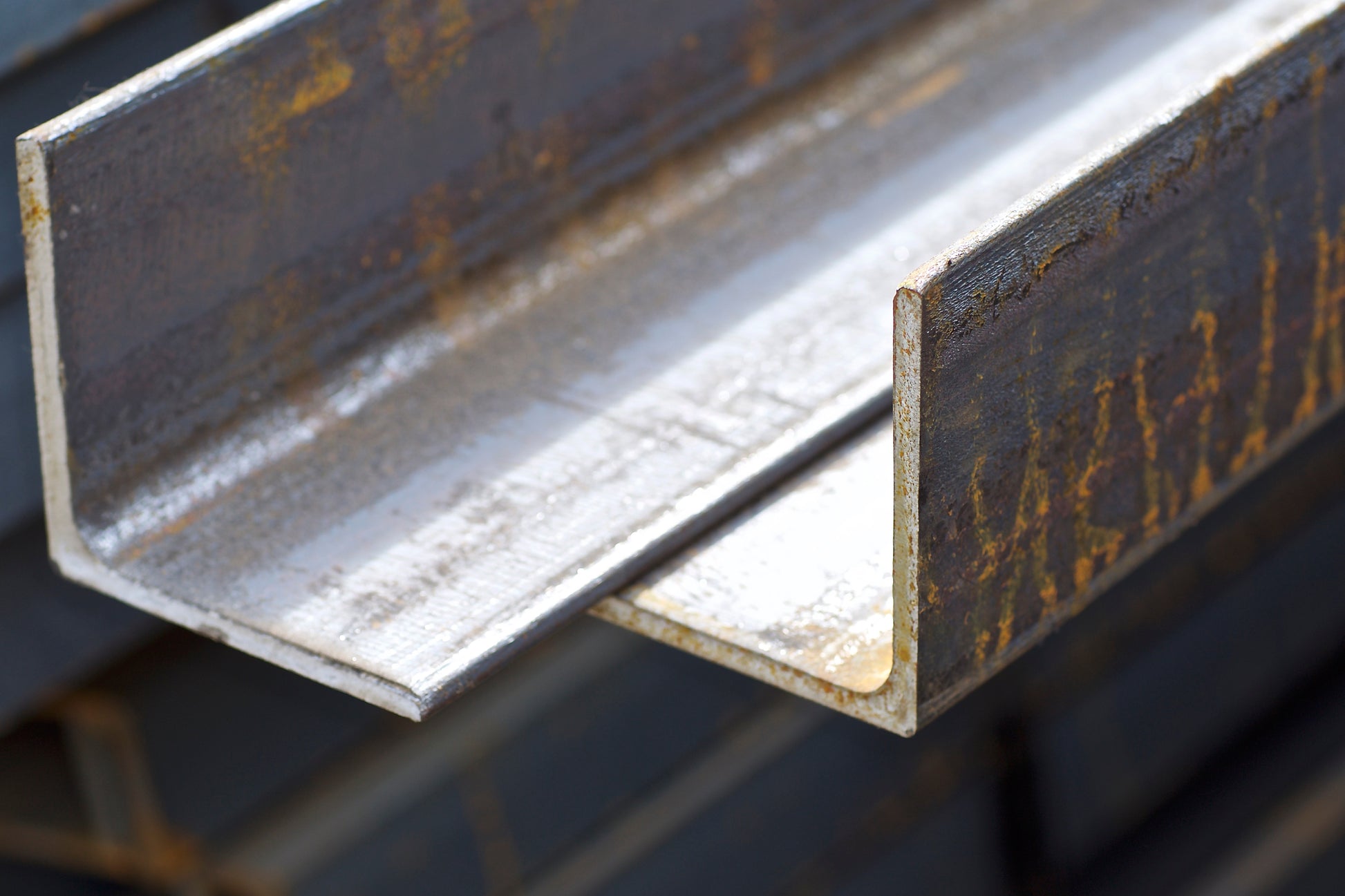 A stack of carbon steel grade A36 angle iron, showing multiple angles iron sheets.